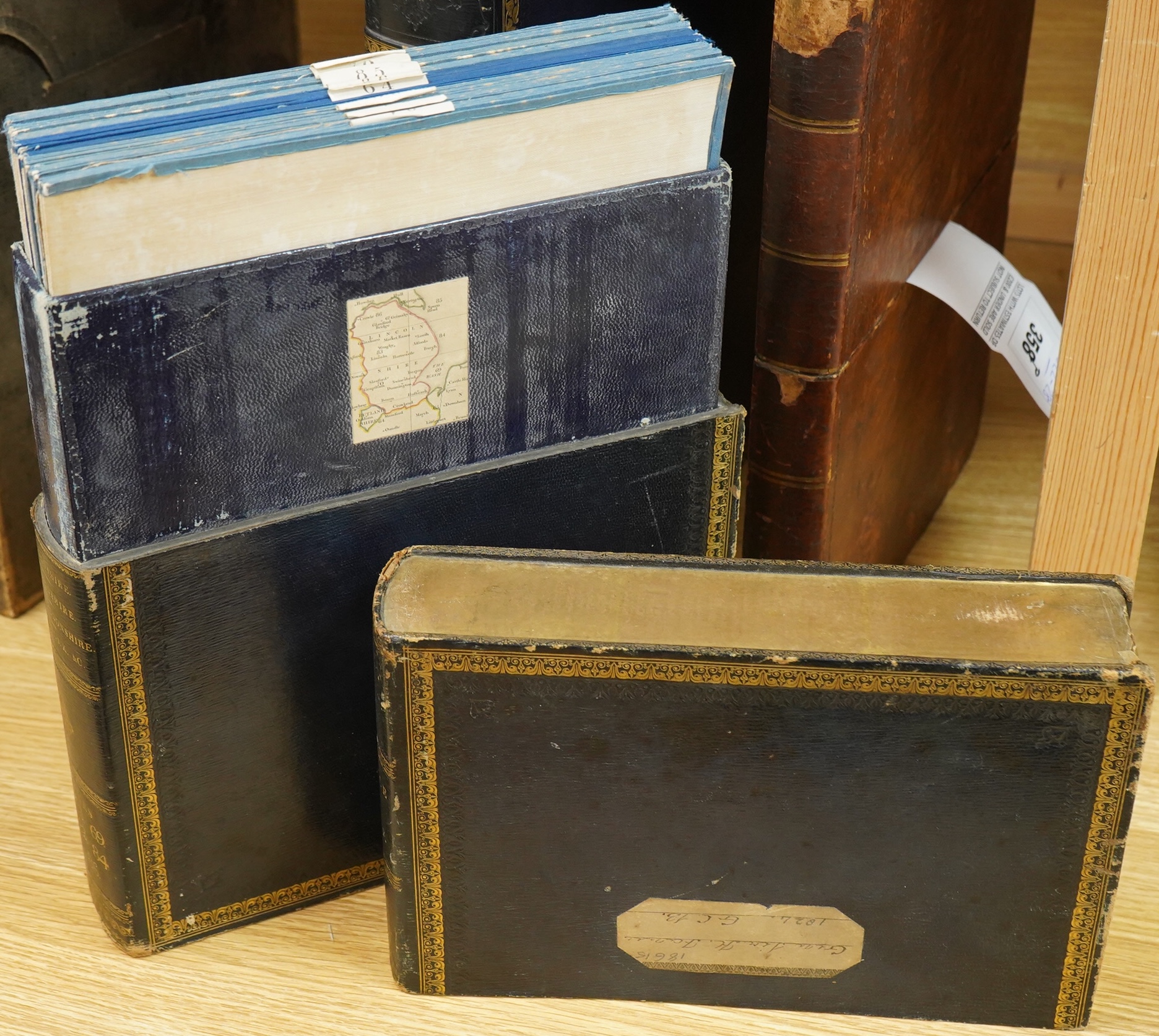 Ordnance Survey maps of Lincolnshire, Rutlandshire, N. Huntingdonshire and W. Norfolk &c., comprising of a set of eight engraved maps mounted on linen and edged with blue cotton, including sheet no.s; 64, 65, 69, 70, 83,